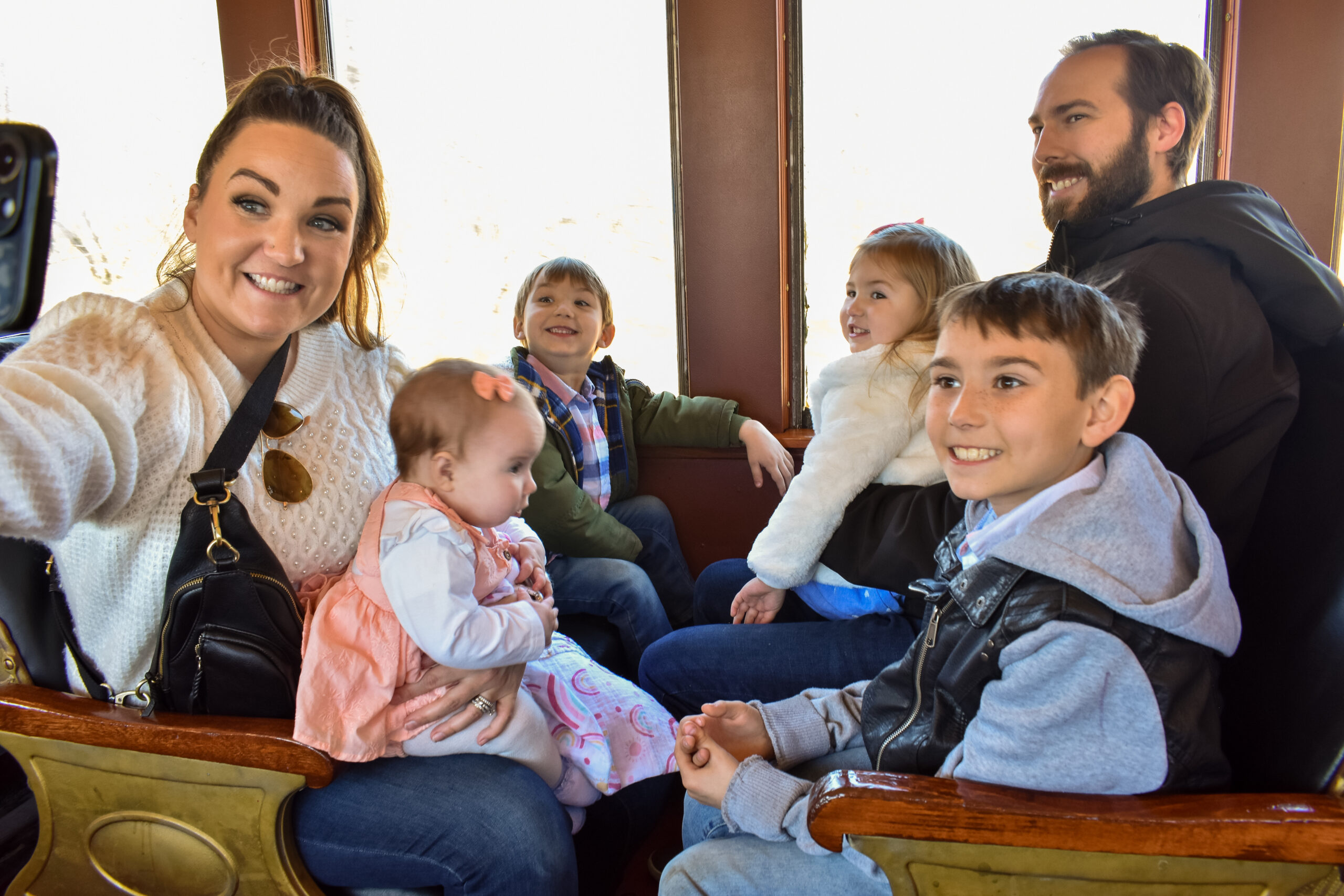 a family enjoys a train ride