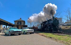 steam engine and vintage cars